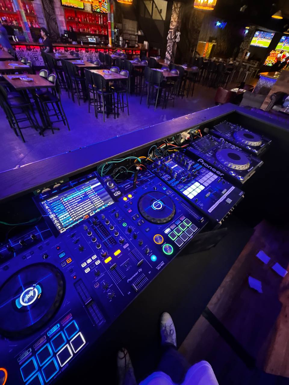 Pioneer CDJ and DJM equipment in a venue booth